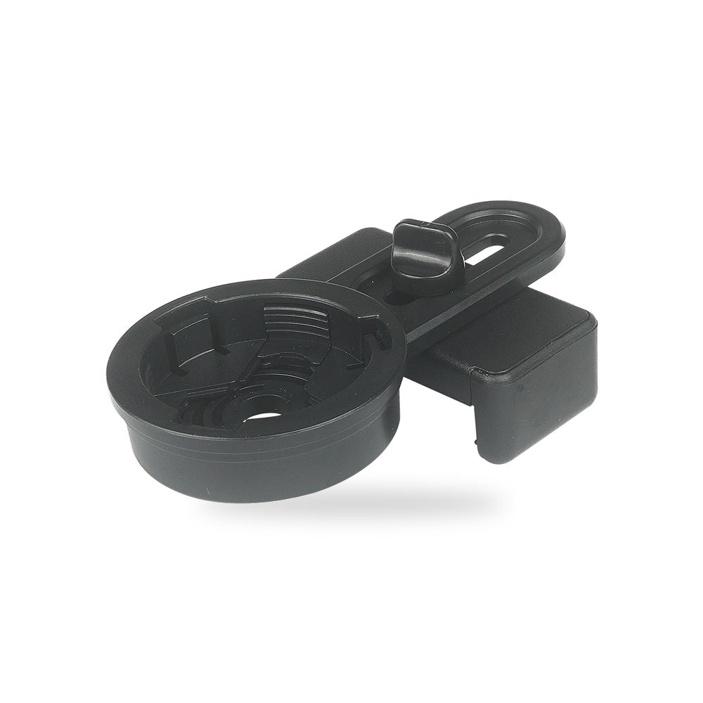 Le support smartphone posé à plat sur sa bague ronde, étrier et pince visibles, sur fond blanc